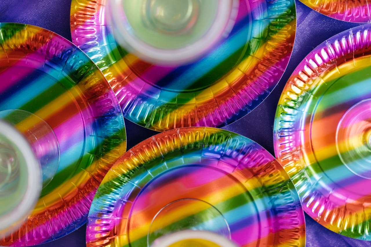 gallery-1 Colorful rainbow-striped disposable plates, perfect for festive occasions.